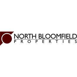 Logo of North Bloomfield Properties with a maroon circle and triangle design on the left.