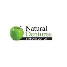 Logo of Natural Dentures & Implant Center featuring a green apple on the left.