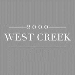 "Gray background with '2000 West Creek' in white text inside a decorative border."