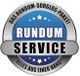 Grauer und blauer Button mit der Aufschrift „Rundum Service“, umgeben von Sternen.