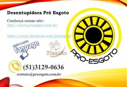 Cartaz da Desentupidora Pró Esgoto com contatos e links do site e redes sociais.