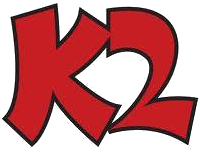 Logo rosso con la scritta "K2" in stile cartone animato, contorni neri.