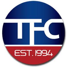 Blue and red circular logo with "TFC" and "Est. 1994" text.