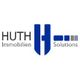 Logo von Huth Immobilien Solutions mit blau-grauen Elementen.