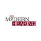 "Modern Hearing logo with an ear graphic replacing the 'O' and 'Hearing' in red text."