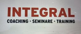 Text: "INTEGRAL - COACHING · SEMINARE · TRAINING" in rot und schwarz auf weißem Hintergrund.
