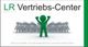 Grüne Figur hebt die Arme vor einer Gruppe; Text: "LR Vertriebs-Center".