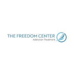 The Freedom Center logo, with blue text and a stylized blue circular symbol.