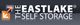 Logo of The Eastlake Self Storage with overlapping arrows in blue and orange.