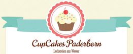 Ein Cupcake-Logo mit Text: "CupCakes Paderborn, Leckereien aus Wewer" auf einem Banner.