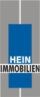 Logo mit blauem Rechteck und dem Text "Hein Immobilien" auf grauem Hintergrund.