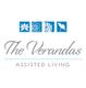 The Verandas logo with floral icons and "Assisted Living" text beneath.