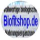 Verschwommenes Logo mit Text: "Biofitshop.de", "vollwertige biologische Nahrungsergänzung."