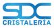 Logotipo azul con las letras "SDC" encima de la palabra "Cristalería".