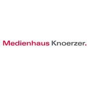 Logo mit Schriftzug: "Medienhaus Knoerzer" in rot und grau.