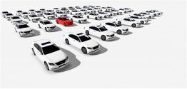A red car among rows of white cars on a white background.