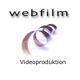 Filmrolle mit Schriftzug "webfilm Videoproduktion" auf weißem Hintergrund.