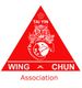 Triangle rouge avec tigre, dragon et yin-yang. Texte: "Tai Yin Wing Chun Association".