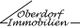 Schriftzug "Oberdorf Immobilien" in stilisiertem Design mit Linien.