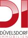 Logo mit rotem "DI", darunter "Düvelsdorf Immobilien" in Schwarz und Rot.