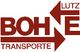 Logo mit roten Pfeilen und Text: "Lutz Bohne Transporte".