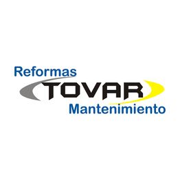 Logo de "Reformas Tovar Mantenimiento" con diseño en azul, gris y amarillo.