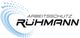 Logo mit blauen Kreisen und dem Text "Arbeitsschutz Rühmann" in Schwarz.