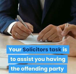 Two people in suits reviewing documents, holding pens; text overlay about solicitors' tasks.