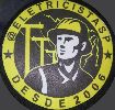 Símbolo circular amarelo e preto com eletricista e a inscrição "@eletricistasp desde 2006".