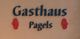 Schriftzug "Gasthaus Pagels" auf einer Wand, verziert mit roten Ornamenten.
