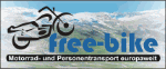 Logo mit Motorrad, Text: „free-bike - Motorrad- und Personentransport europaweit“, im Hintergrund Berge.
