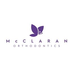 Purple butterfly logo with text: "McClaran Orthodontics" on a white background.