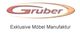 Logo von "Gruber Exklusive Möbel Manufaktur" mit braunem Schriftzug und ovalem Design.