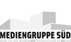 Logo der Mediengruppe Süd, stilisierte Gebäude im Hintergrund, Text darunter.