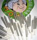 Cartoon granny with marijuana joints on a green and white circular background.