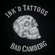 Illustration eines verzierten Schädels mit Schriftzug "INK'D TATTOOS BAD CAMBERG".