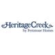Heritage Creek by Fernmoor Homes logo with elegant dark blue text on a white background.