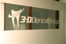 3-D Dental Group logo on frosted glass with a tooth illustration.
