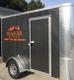 Trailer with "TRAEGER Wood Fired Grills" and "Honk if you are hungry!" on the side.