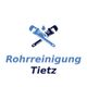 Logo von Rohrreinigung Tietz mit blauen und schwarzen Schraubenschlüsseln und Wassertropfen.