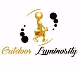 Gold figure walking with a briefcase near the text "Outdoor Luminosity" with black circles.