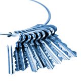 A set of silver keys on a ring, fanned out and isolated against a white background.