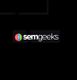 Logo of "semgeeks" with a colorful target icon on a black background.