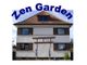 Zweistöckiges Haus mit Schriftzug "Zen Garden", eingangs ein Tor in Zen-Stil.