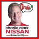 Man smiling next to "Orale!" speech bubble, below "Charlie Clark Nissan Brownsville" text.