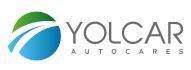 Logotipo de Yolcar Autocares con diseño circular verde y azul a la izquierda.