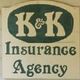 Sign reading "K&K Insurance Agency" with green text on a beige background.