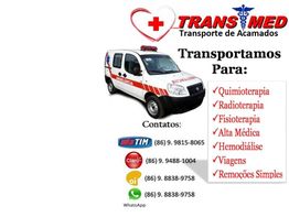 Ambulância da Trans Med com serviços de transporte médico e contatos telefônicos listados.