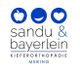 Logo von Sandu & Bayerlein Kieferorthopädie mit Symbolen Apfel, Lächeln, Herz. Text: Mering.