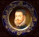 Plato decorativo con un retrato antiguo de un hombre con gola y vestimenta de época, detalles dorados.